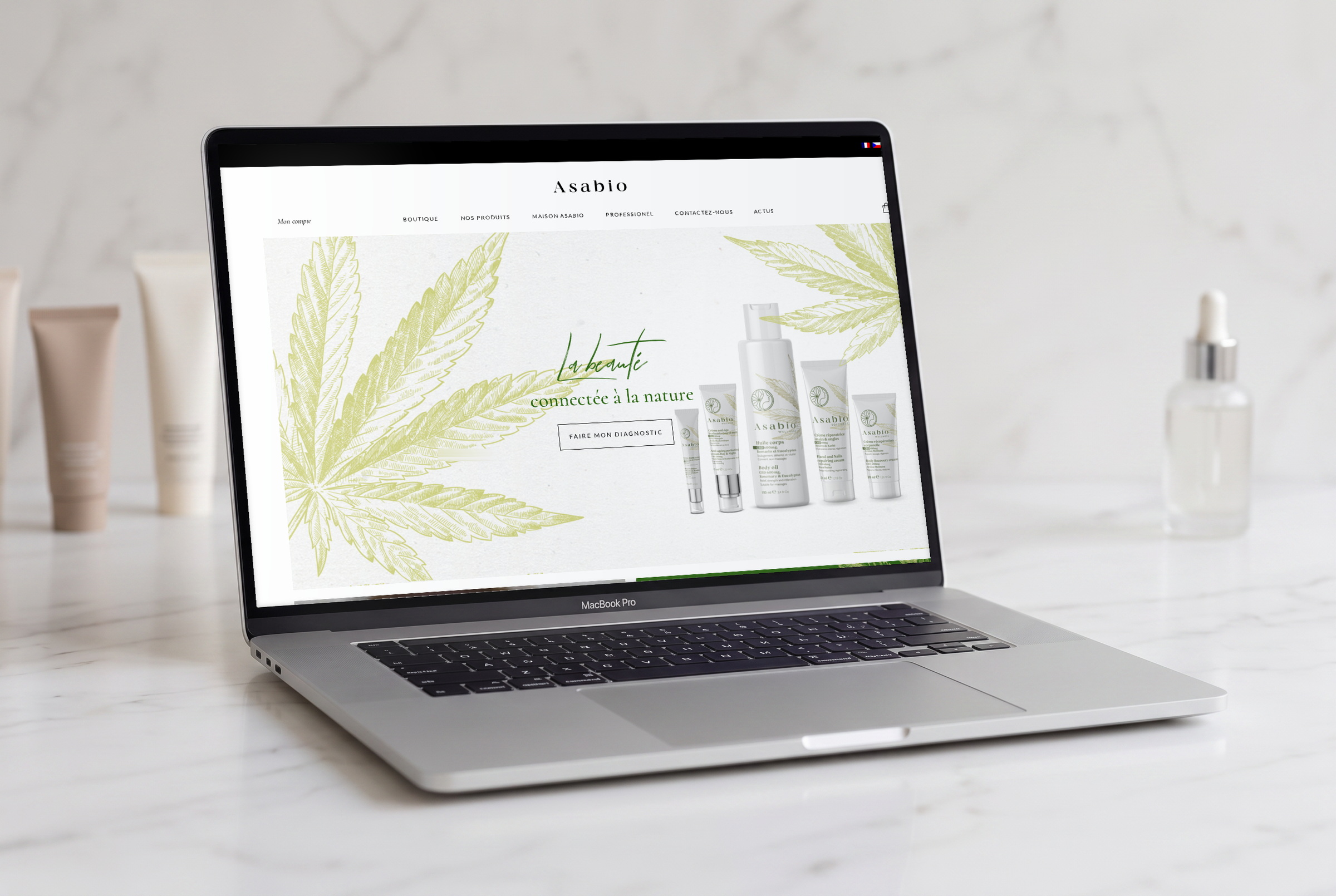 Asabio — náhled webu v mockupu MacBooku